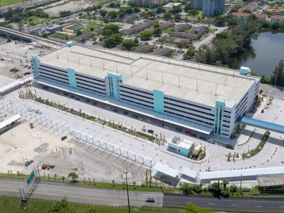 Arial view of a white parking garage.