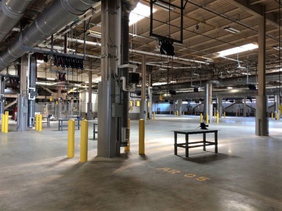 The new, larger bus maintenance facility meets the maintenance needs of 165 buses. Image showing interior of the bus maintenance facility.