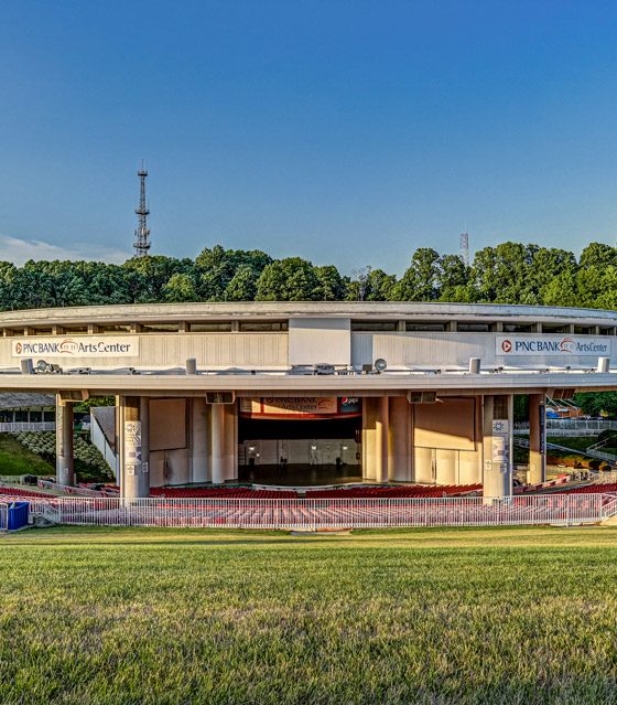 PNC Bank Arts Center’s amphitheater was built in 1968. Between indoor and outdoor seating on the lawn, shown in the foreground, about 17,500 people can occupy the venue.