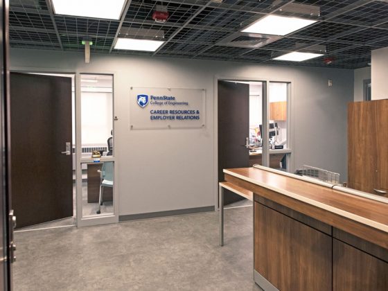 Reception desk with two doorways leading to offices.