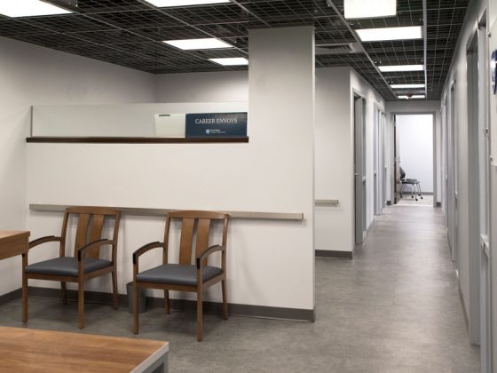 Small waiting area with interior hallway leading to offices.