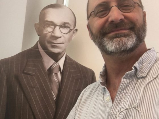 Dave Gilbert takes a self-portrait with a life-size cardboard cutout of Farley Gannett.