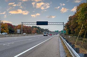 A new variable message sign extends above Interstate 93.